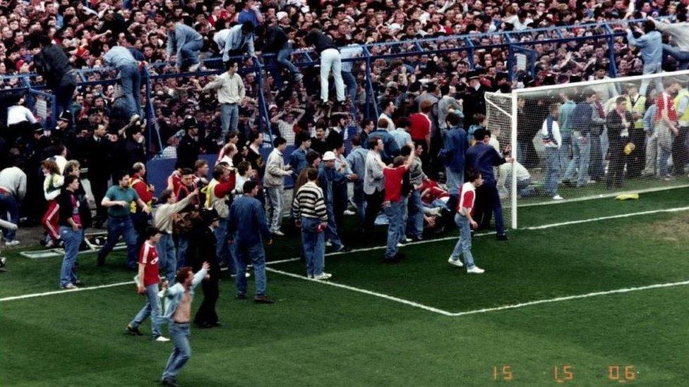 Liverpool fans escaping packed pens at Hillsborough