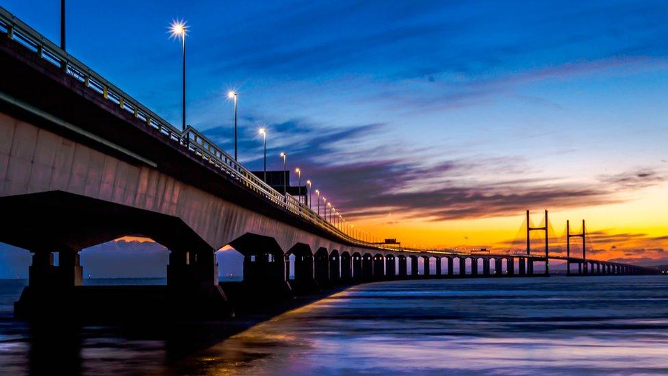 The second Severn crossing towards Wales, with the sun going down