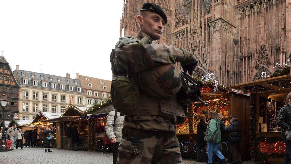 A French soldier patrols in the Christmas market area near the Cathedral in Strasbourg, eastern France, on November 25, 2016