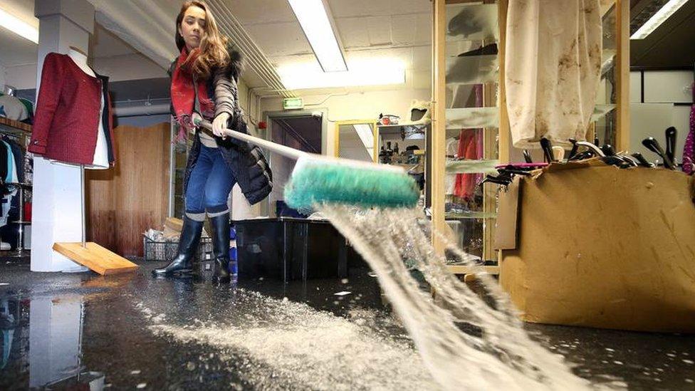 Sweeping out water at The Boudoir in the Linen Green complex