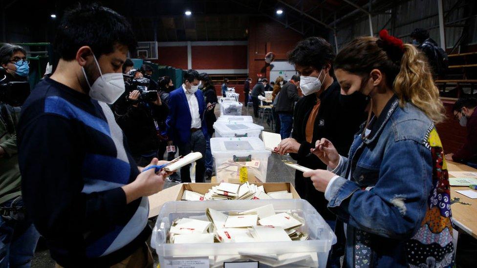 Chilean citizens count the votes at the end of the electoral day during the Constitutional Convention Election