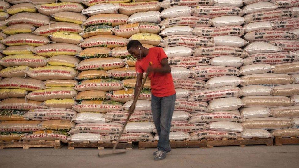 Man sweeps in front of food aid