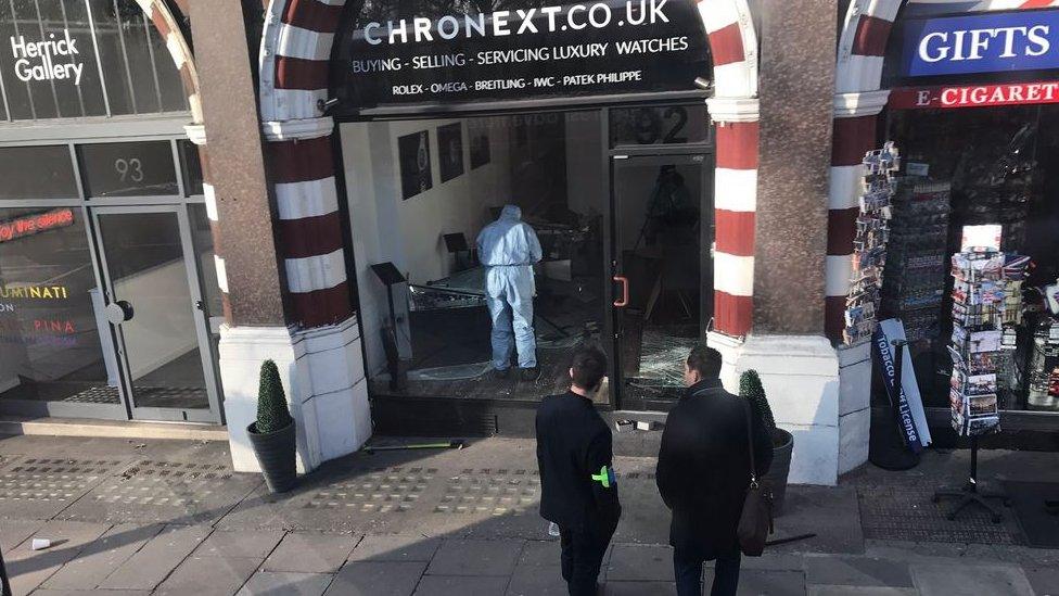 Forensics officers carried out their investigation in the Chronext store.