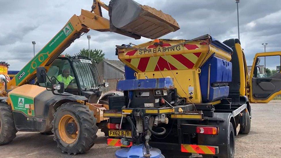 Gritter being loaded with sand