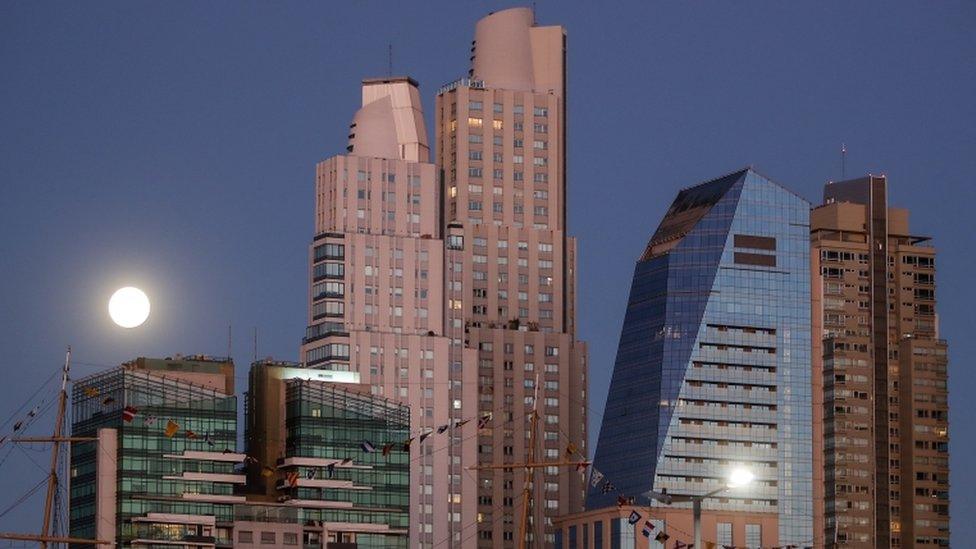 In Argentina, ahead of the lunar eclipse, the super bright Moon was reflected in the windows of skyscrapers in Buenos Aries.