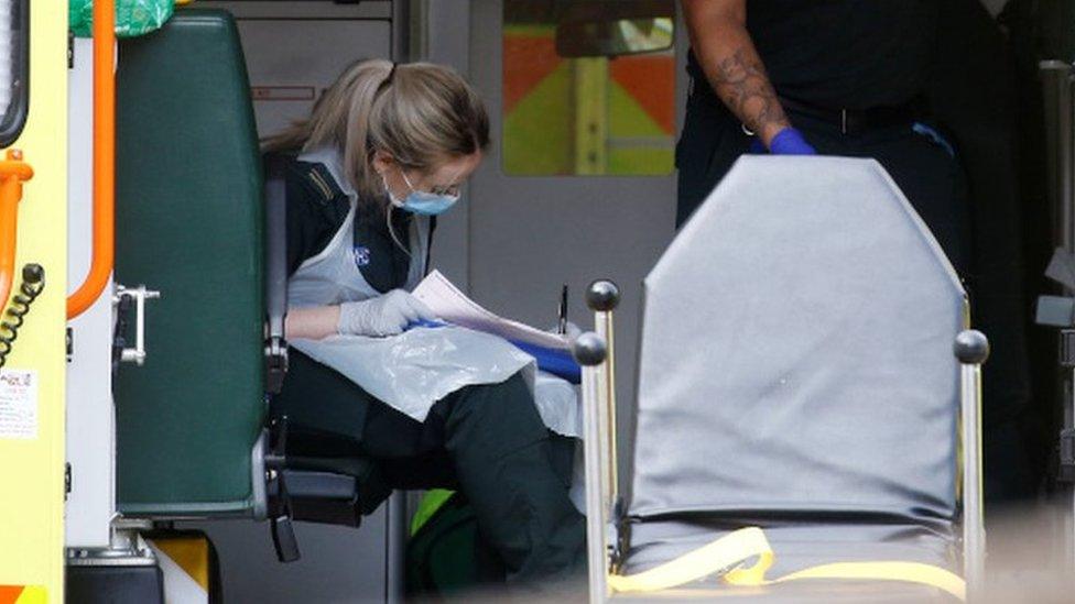 Paramedic wearing protective apron