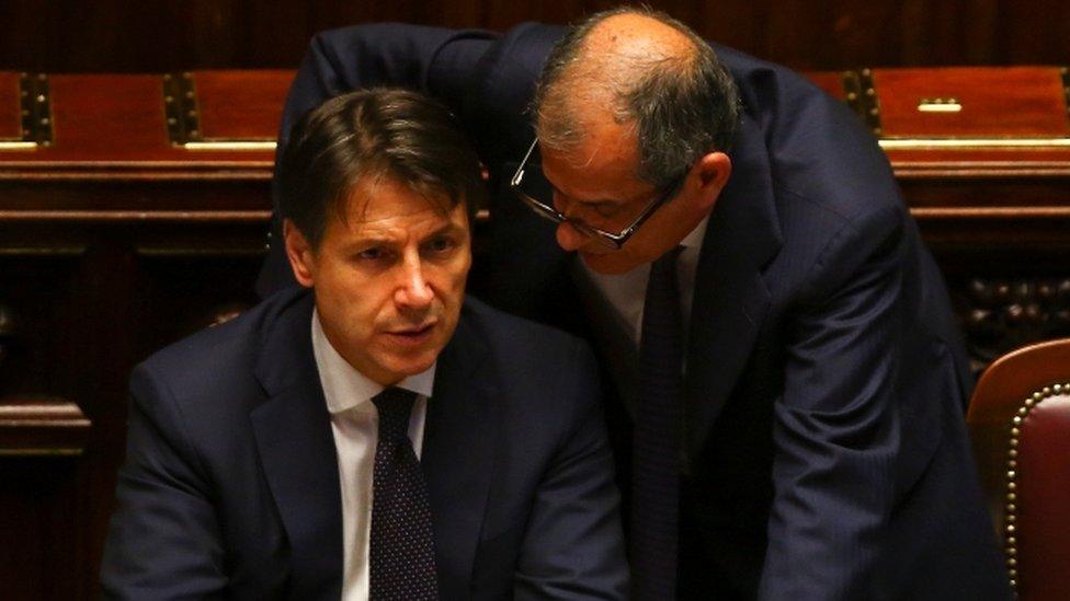 Italian Prime Minister Giuseppe Conte talks with Economy Minister Giovanni Tria