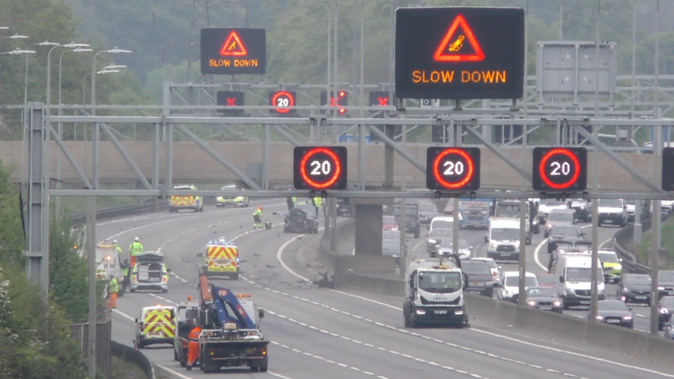 Emergency services at the scene of a crash on the M1 northbound by Luton in Bedfordshire