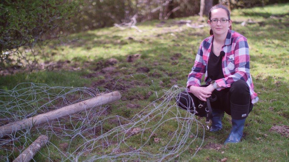 Sam Pearce with some of the damaged fencing