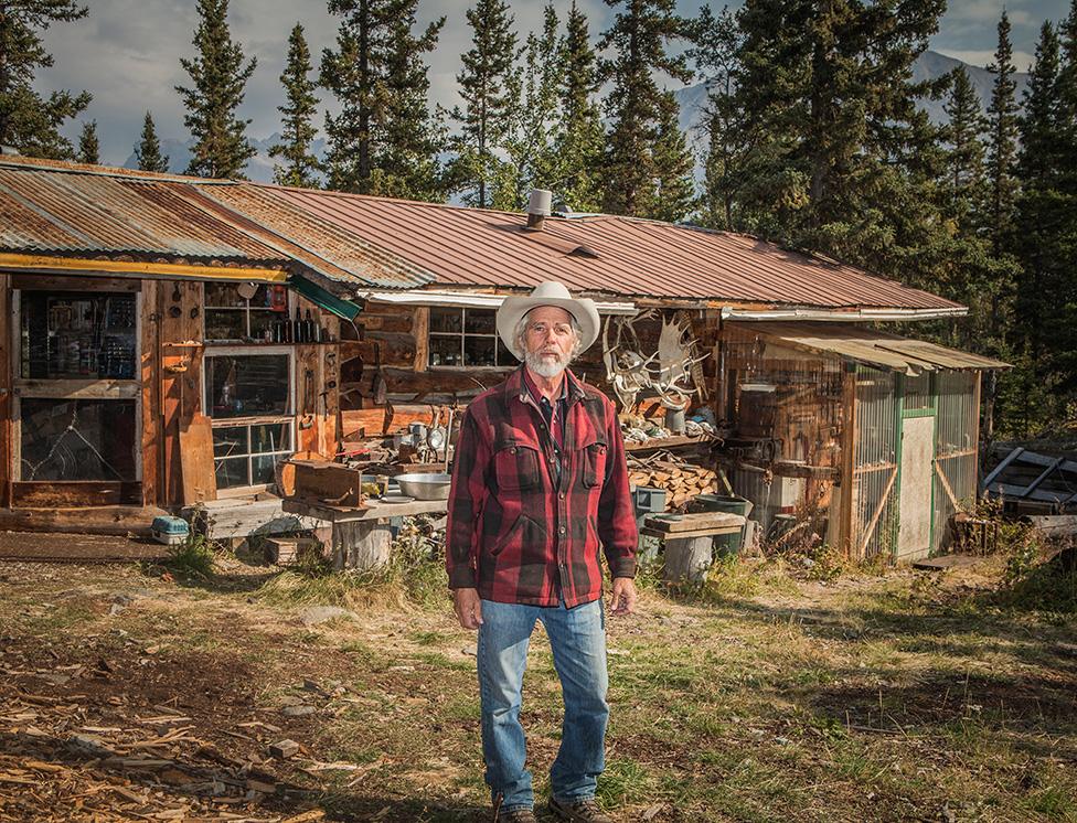 Gary Green standing outside a house