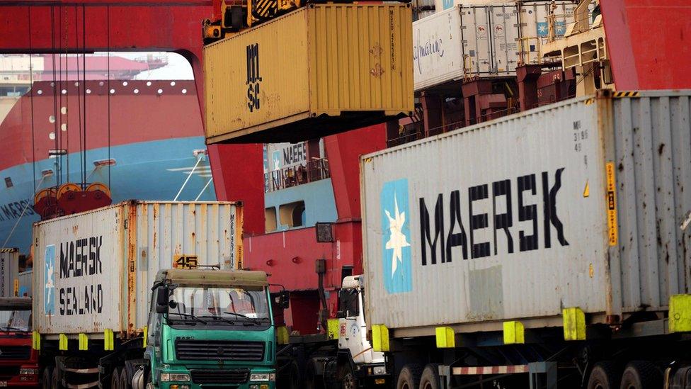 Trucks transporting containers at a port in Qingdao