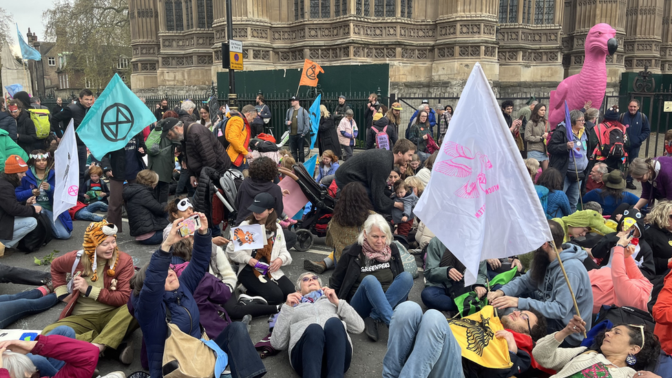 Demonstrators take part in a "die-in" on Saturday