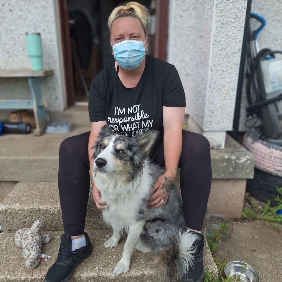 Woman, Katrina Archer, with Freckles the border collie dog.