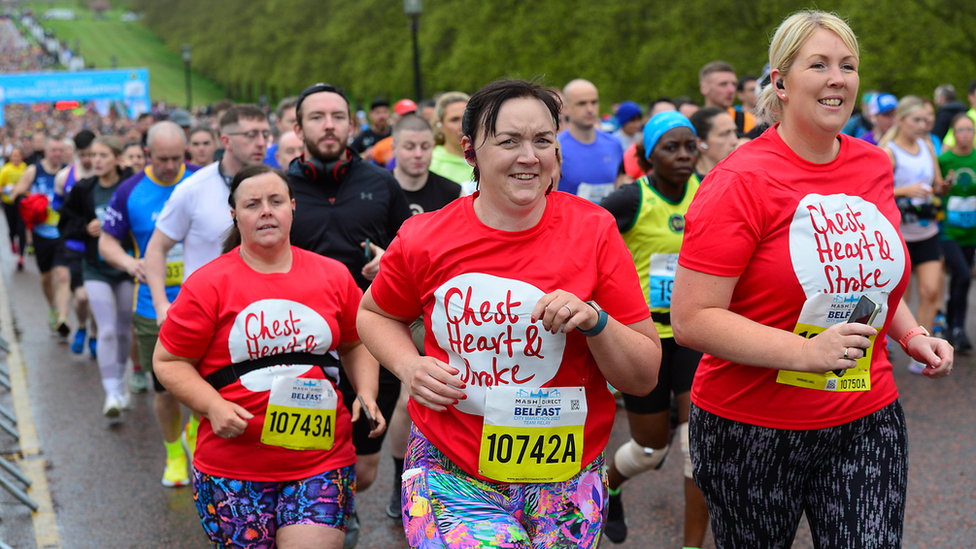 Three women running at the Belfast City Marathon