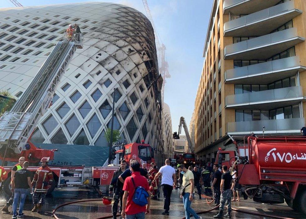 Fire fighters extinguish a blaze at the Beirut Souks shopping centre, which is under construction in Beirut, Lebanon (15 September 2020)