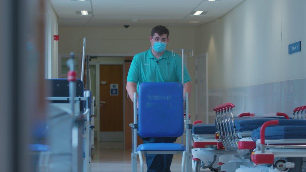 Aidan in his job as a porter