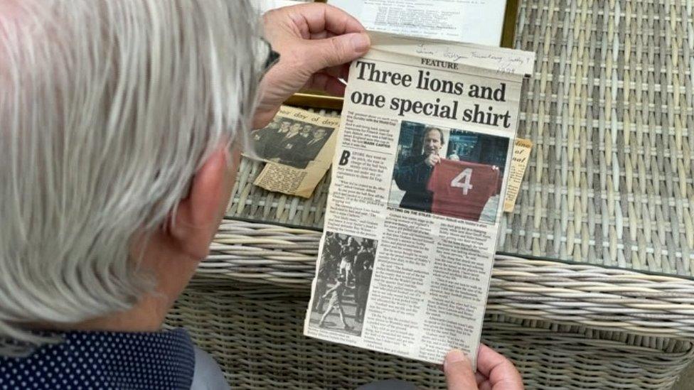 Graham Abbott looking at memorabilia from the day