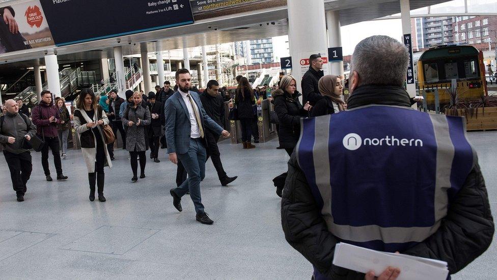 commuters at rail station