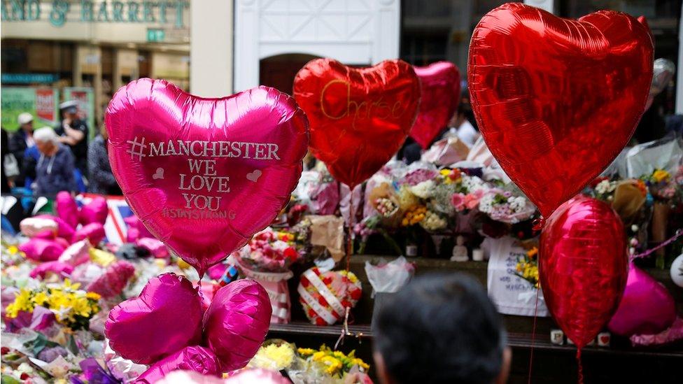 Flowers and tributes in St Ann's Square in Manchester