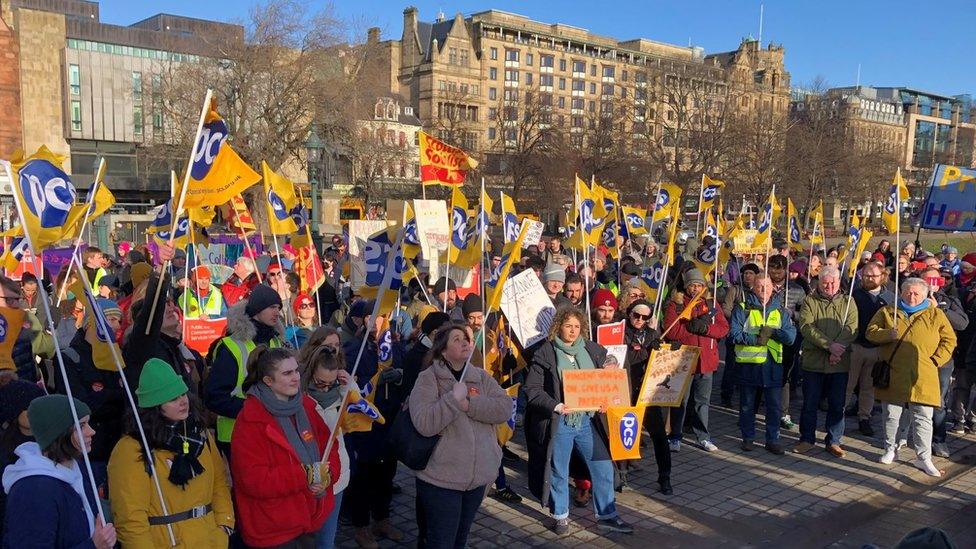 People gather at a rally at The Mound in Edinburgh to protest against the government's new strikes bill