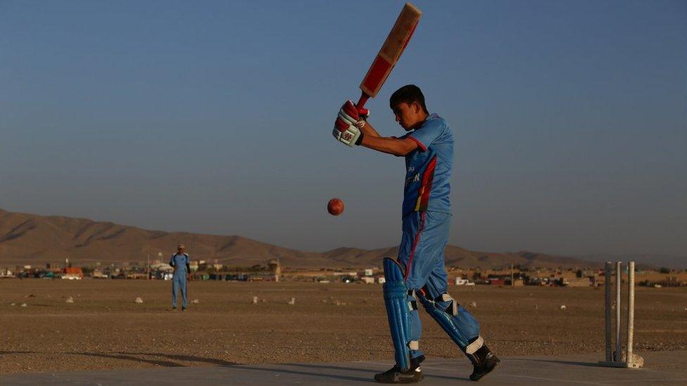 A boy playing cricket in Ghazni province