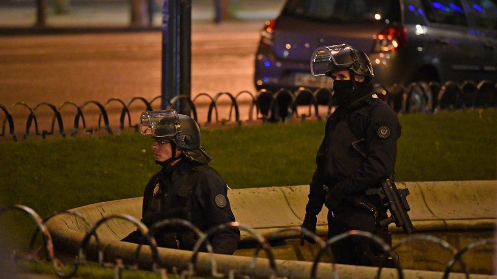 Police officers secure the area after a gunman opened fire on the Champs Elysees in Paris, 20 April 2017