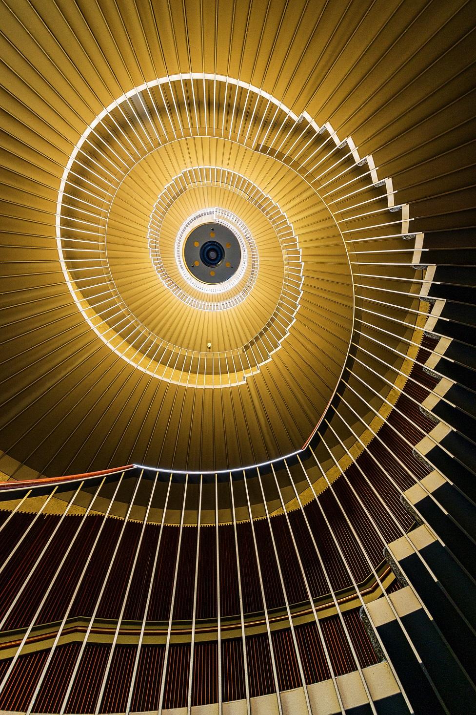 A view looking upward at a spiral staircase