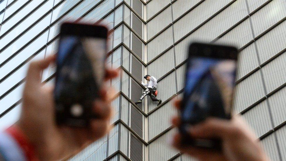 Alain Robert climbing the Heron Tower