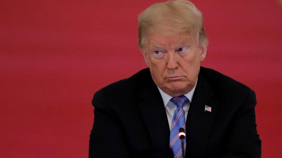 U.S. President Donald Trump listens during a meeting of the American Workforce Policy Advisory Board in the East Room at the White House in Washington