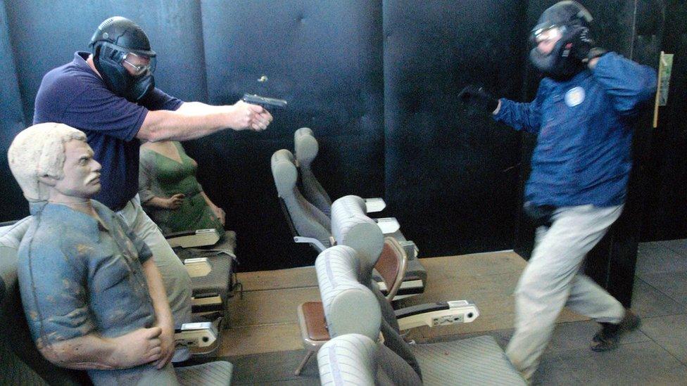 A firearm instructor teaching pilots in Artesia in October 2003