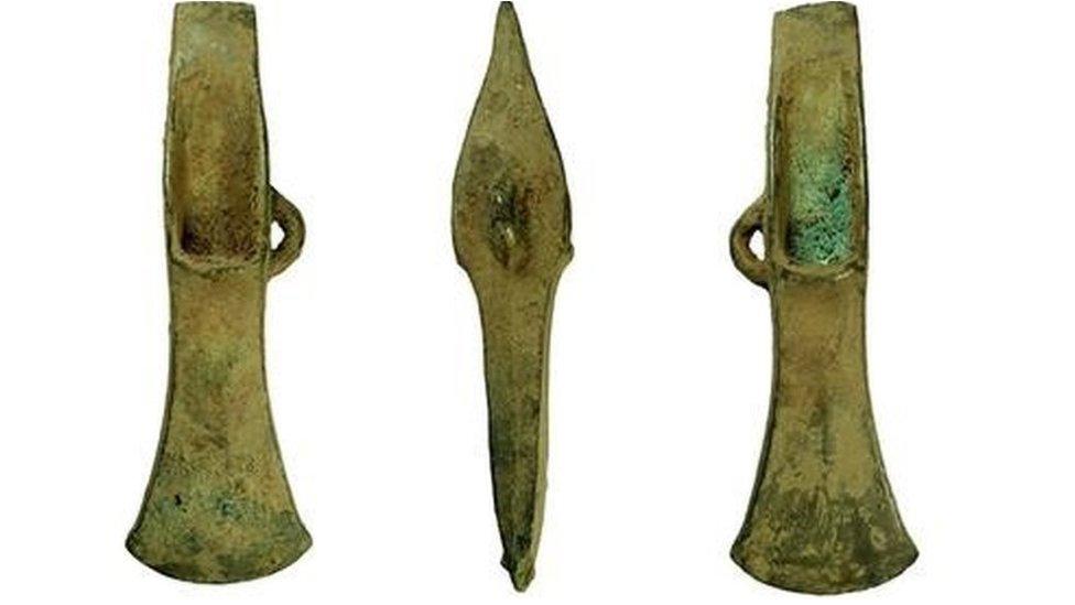 Three angles of the palstave axe head