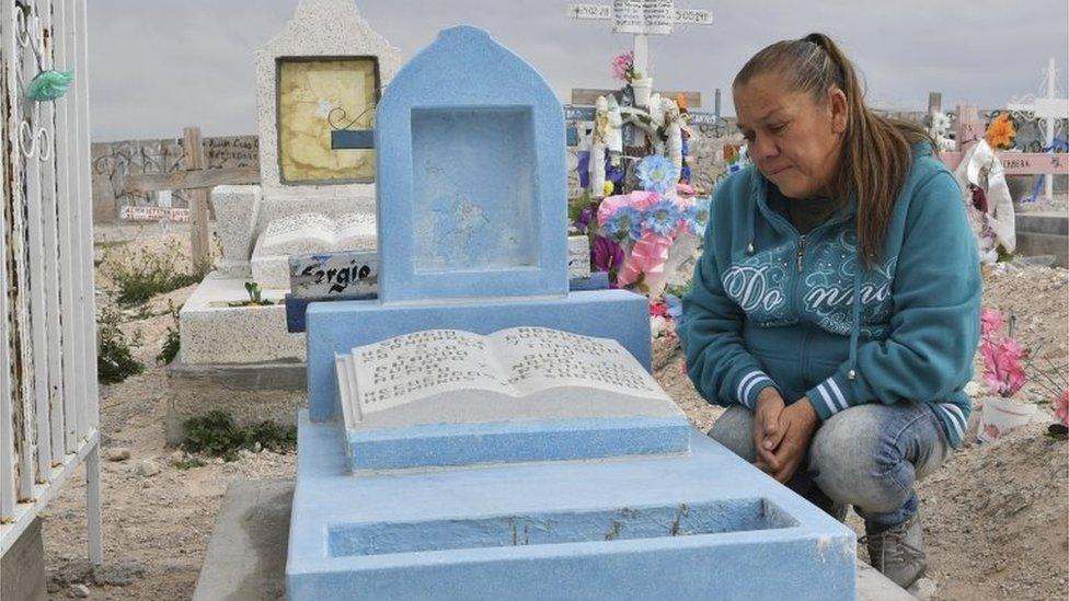 Maria Guadalupe Guereca visits the grave of her son, Sergio Hernandez, in Juarez, Mexico.