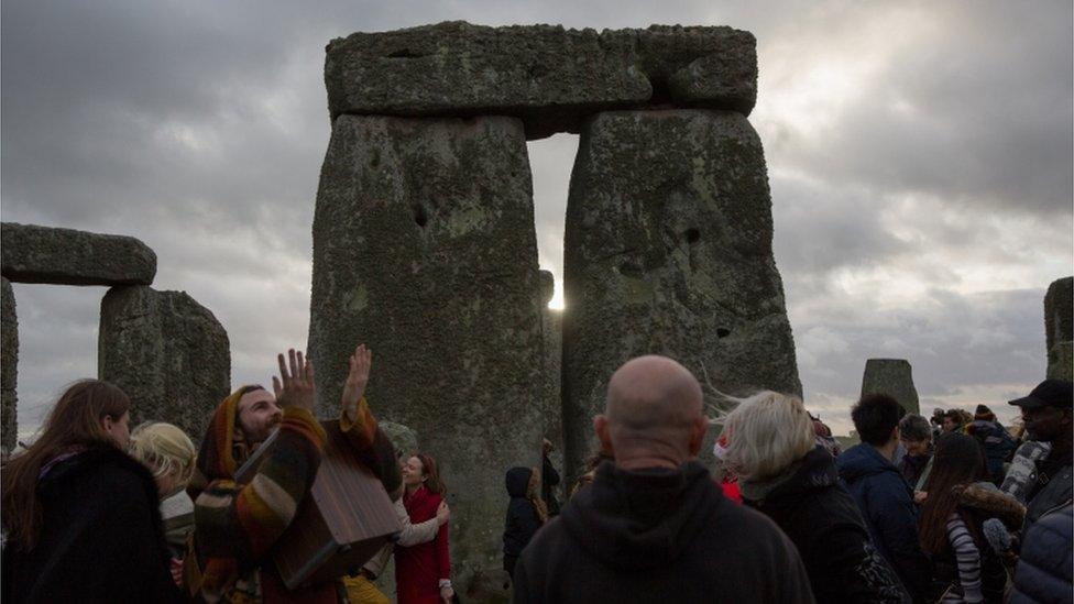 The sun peeps out through the stones