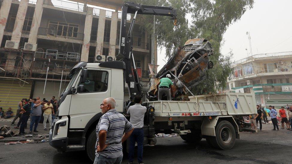 Car cleared away in Karrada, Baghdad. 3 July 2015