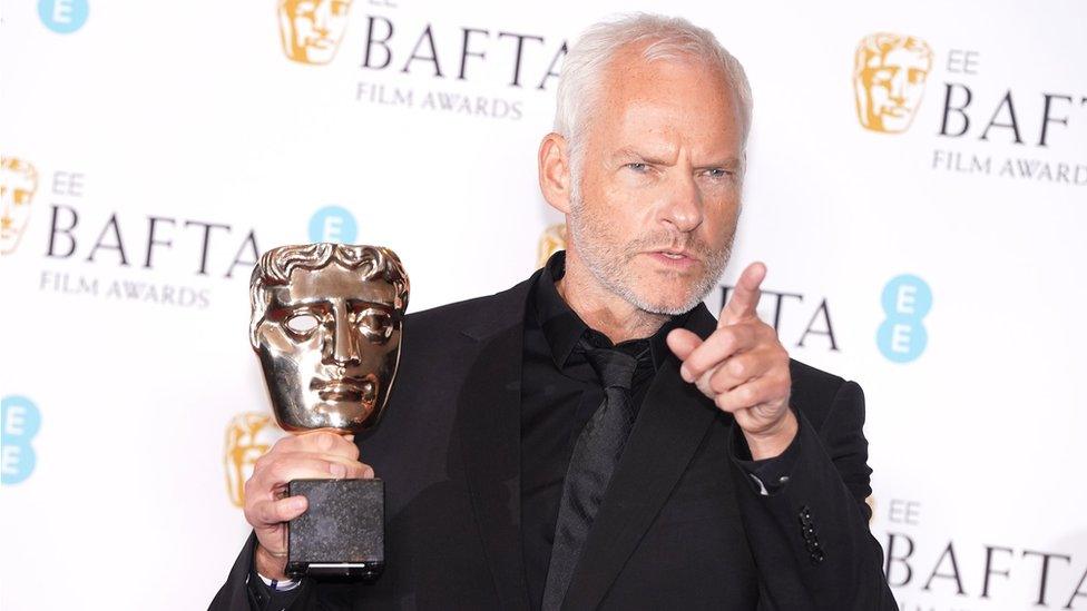 Martin McDonagh after winning a BAFTA award.