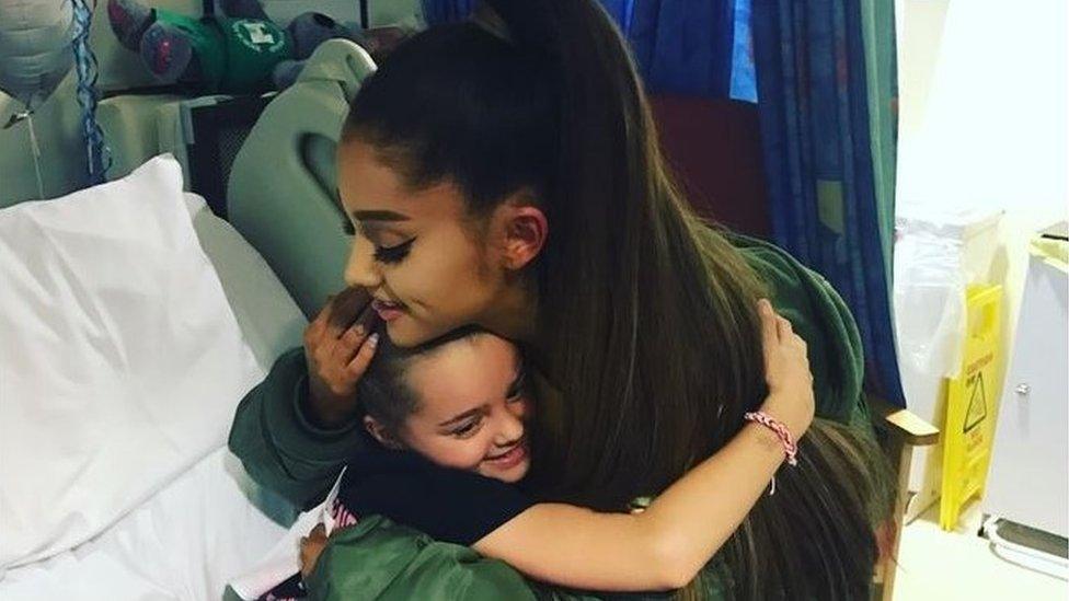 Ariana Grande hugs Lily Harrison