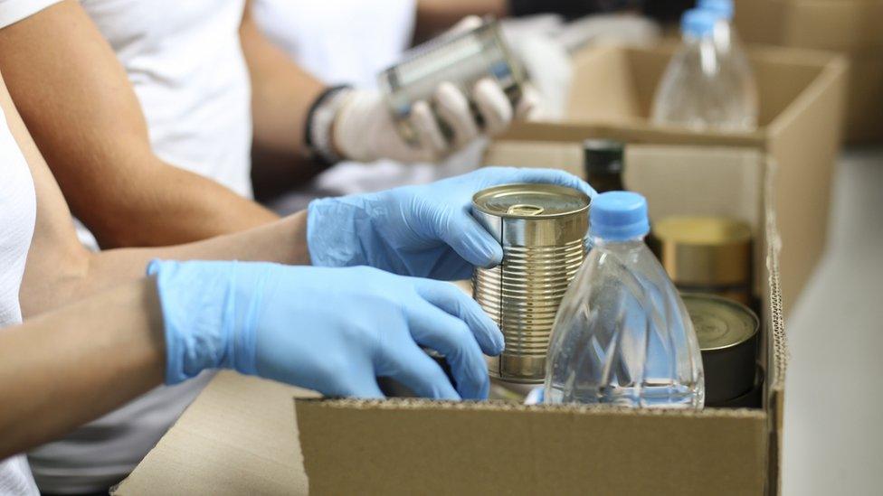 Food bank staff preparing food parcels