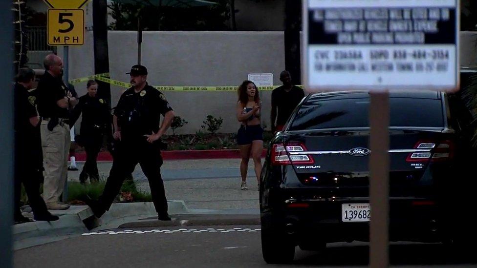 Pool-goers waited for information outside the apartment complex