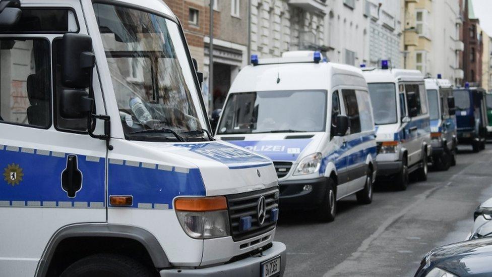 Image of generic German police vehicles on a street, for stock purposes.