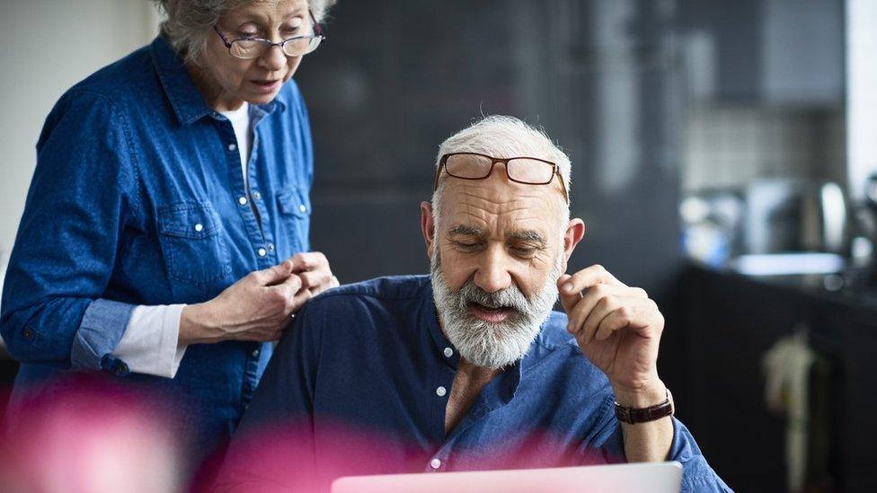 File image of two people looking at a laptop