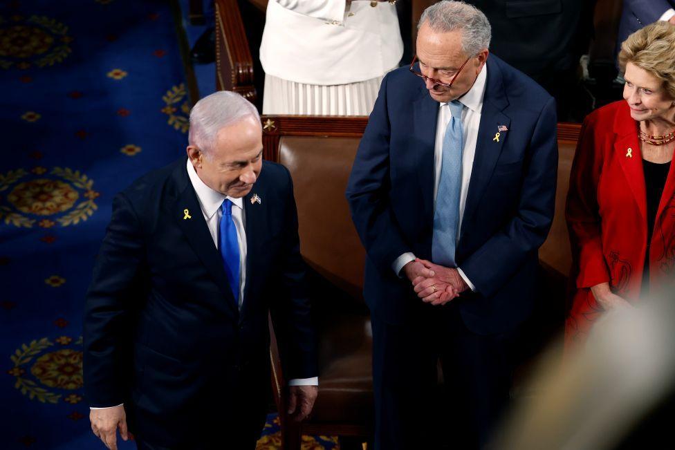Schumer watches as Israeli Prime Minister Benjamin Netanyahu arrives before he addresses a joint meeting of Congress in the chamber of the House of Representatives at the US Capitol in July 2024