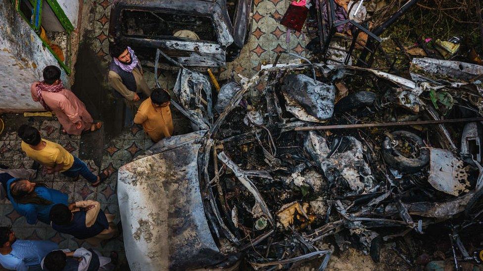 View from above of wreck of car struck by US missile