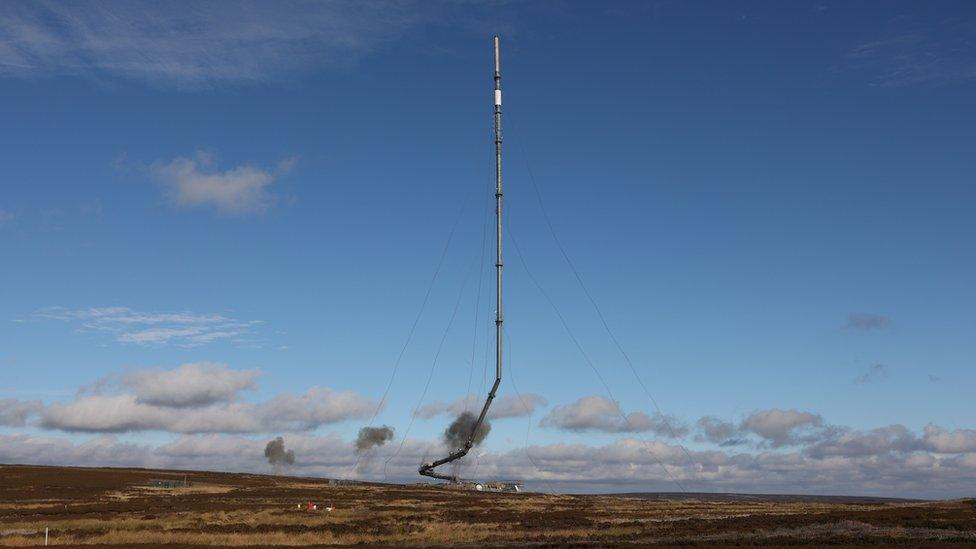 The Bilsdale TV and radio mast collapsing as part of the controlled demolition