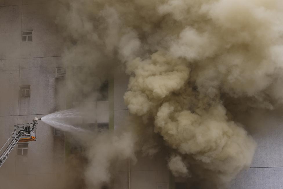 A blaze is seen at a warehouse in the city's bustling Kowloon district, in Hong Kong, China March 24, 2023.