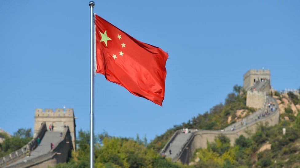 China flag by great wall