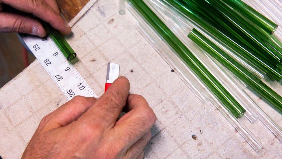 Glass straws being made