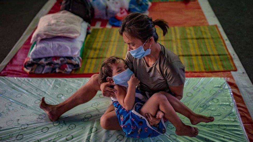 Homeless child and mother in shelter in Manila, Philippines - 1 April