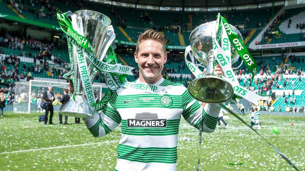 Kris Commons lifts the League and League cup for Celtic after the Scottish Premiership Match between Celtic and Inverness Caley Thistle at Celtic Park on May 24, 2015