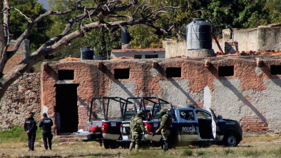 Authorities work at the scene where members of an armed group opened fire to partygoers attending a posada, in Salvatierra, in Guanajuato state, Mexico, December 17, 2023.