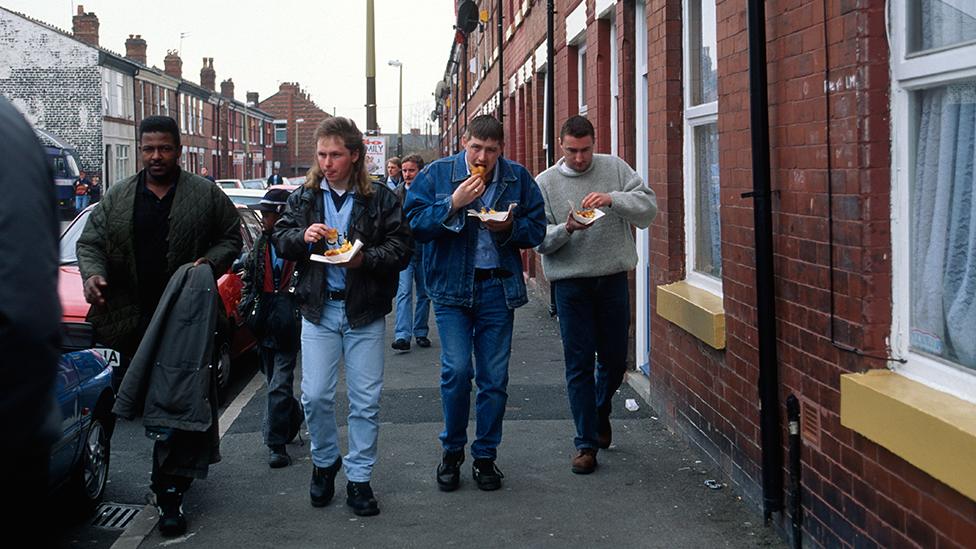 Fans on their way to a Manchester City match